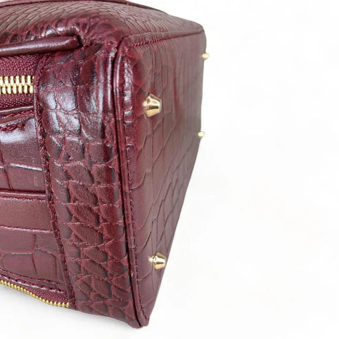 Red leather women's handbag – premium satchel and shoulder bag with elegant stitching, gold-tone hardware, and adjustable strap – luxury fashion accessory for women.