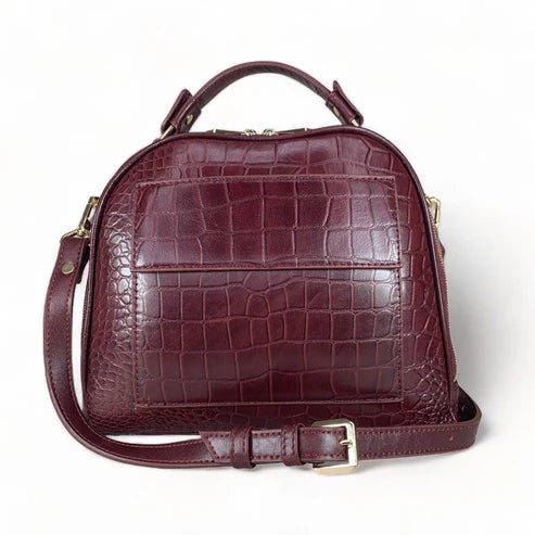 Red leather women's handbag – premium satchel and shoulder bag with elegant stitching, gold-tone hardware, and adjustable strap – luxury fashion accessory for women.
