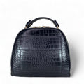 LeatherLuxe black leather women’s handbag – elegant crocodile-textured satchel bag with premium glossy finish and gold hardware.