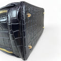 LeatherLuxe black leather women’s handbag – elegant crocodile-textured satchel bag with premium glossy finish and gold hardware.