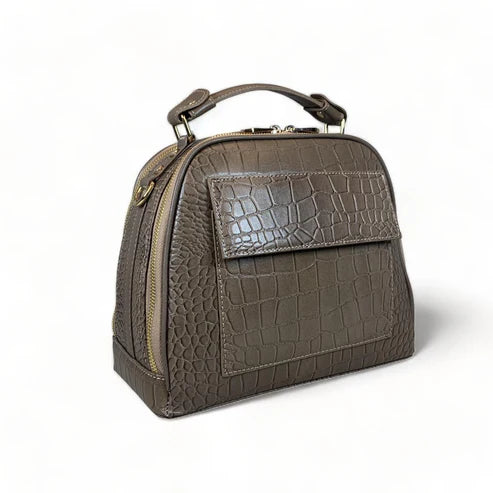 Elegant khaki leather handbag for women with shoulder strap and top handle, perfect for casual and formal outfits.
