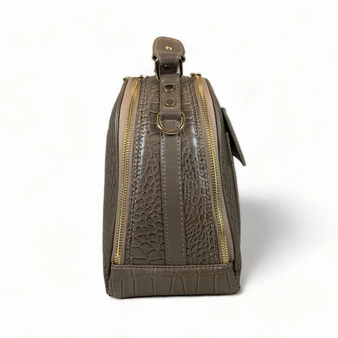 Elegant khaki leather handbag for women with shoulder strap and top handle, perfect for casual and formal outfits.