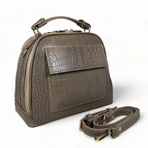 Elegant khaki leather handbag for women with shoulder strap and top handle, perfect for casual and formal outfits.