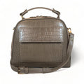 Elegant khaki leather handbag for women with shoulder strap and top handle, perfect for casual and formal outfits.