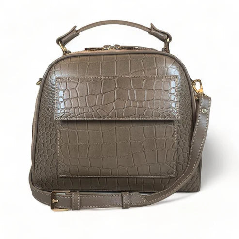 Elegant khaki leather handbag for women with shoulder strap and top handle, perfect for casual and formal outfits.
