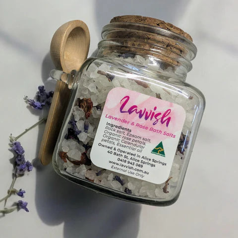 Lavvish Lavender and Rose Bath Salts in glass jar with wooden spoon and floral accents