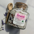 Lavvish Lavender and Rose Bath Salts in glass jar with wooden spoon and floral accents