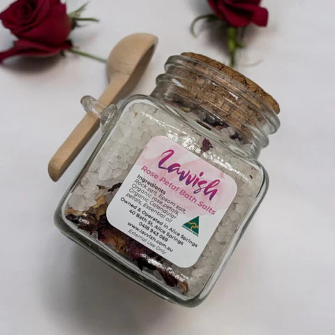 Lavvish Lavender and Rose Bath Salts in glass jar with wooden spoon and floral accents