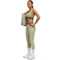 Woman wearing Puma athletic wear on a white background