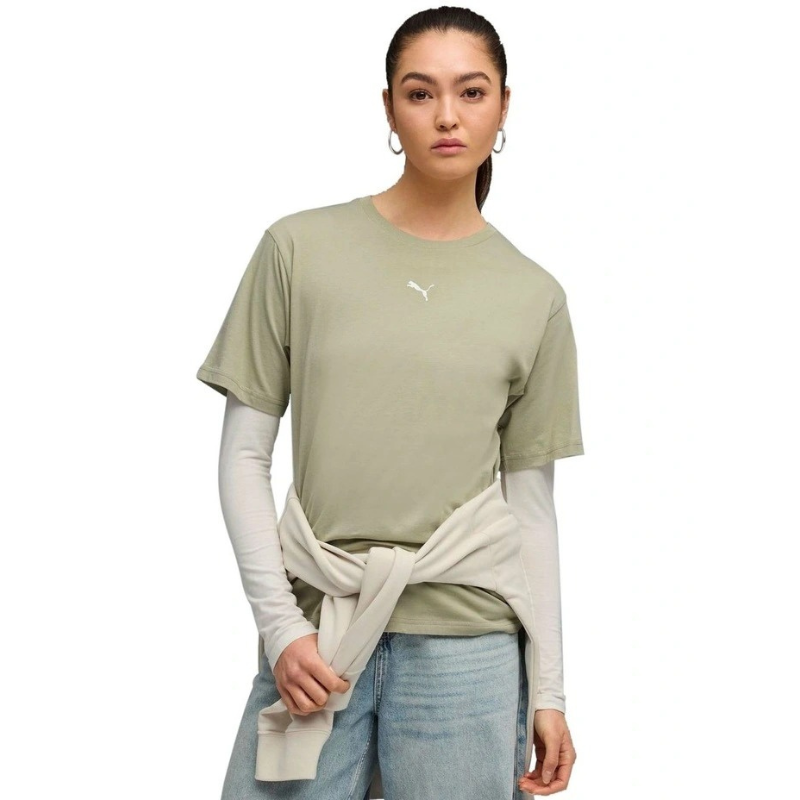 Woman wearing a green t-shirt with a brand logo on a white background