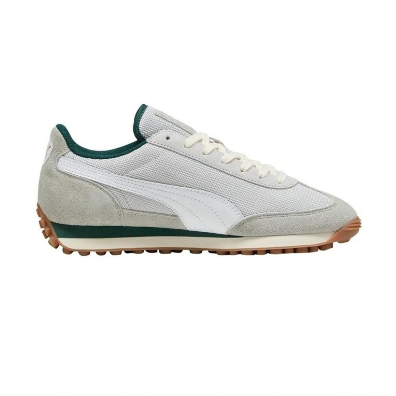 Sneaker with green accents on a white background