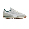 Sneaker with green accents on a white background