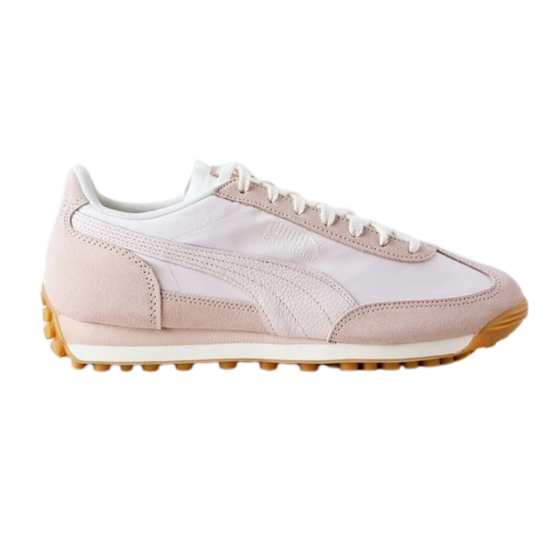 Beige sneaker with brown sole on a white background
