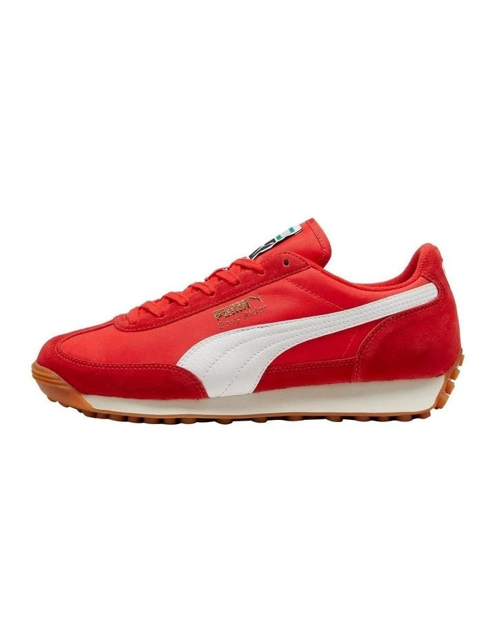Red sneaker with white sole on a white background