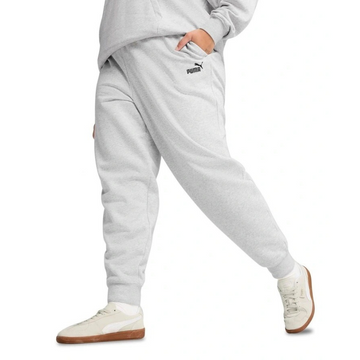 Person wearing gray Puma sweatpants on a white background