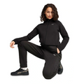 Person wearing a black Puma tracksuit on a white background