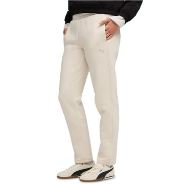Person wearing beige pants with a white background