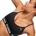 Black Puma sports bra on a model against a white background