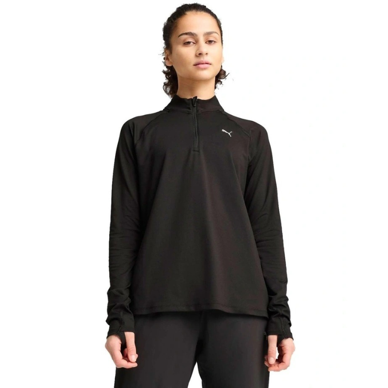Person wearing a black long-sleeve athletic top with a brand logo on a white background