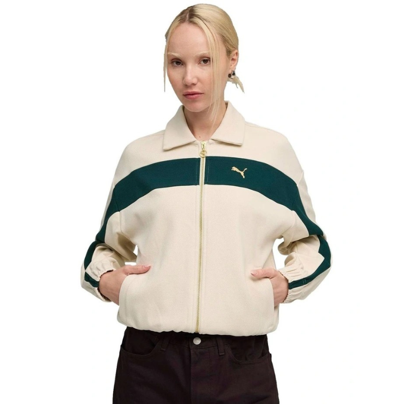 Person wearing a cream and green jacket with a brand logo on a white background