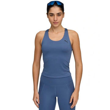 Woman wearing a blue athletic outfit with a Puma logo on a white background