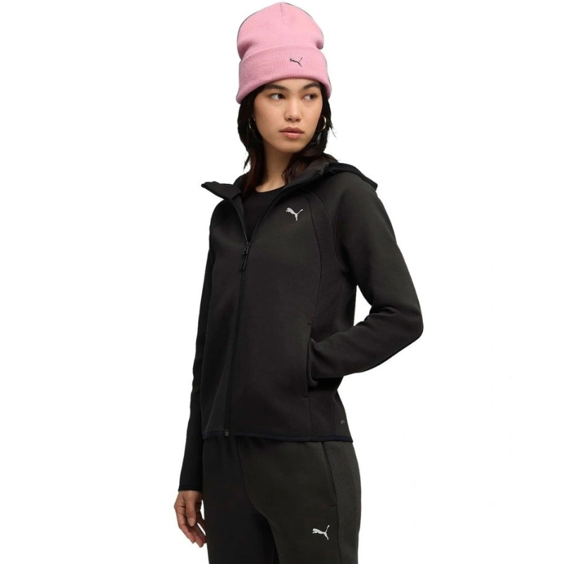 Person wearing a black tracksuit and pink beanie with Puma logo on a white background