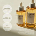 Two bottles of Centella Skin1004 serum on a light background with text about product features.