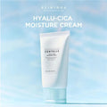 Skint004 Hyalu-Cica Moisture Cream tube on a light blue gradient background