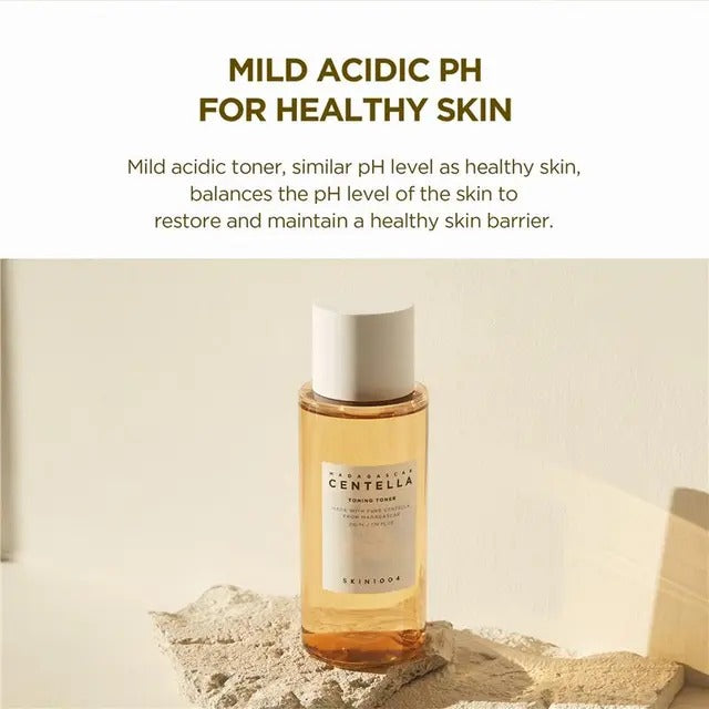 Skincare bottle with text about mild acidic pH for healthy skin on a beige background