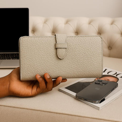 Elegant premium cream leather clutch by LeatherLuxe with sleek design and built-in phone compartment – luxury women’s accessory for everyday and evening use.