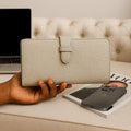 Elegant premium cream leather clutch by LeatherLuxe with sleek design and built-in phone compartment – luxury women’s accessory for everyday and evening use.