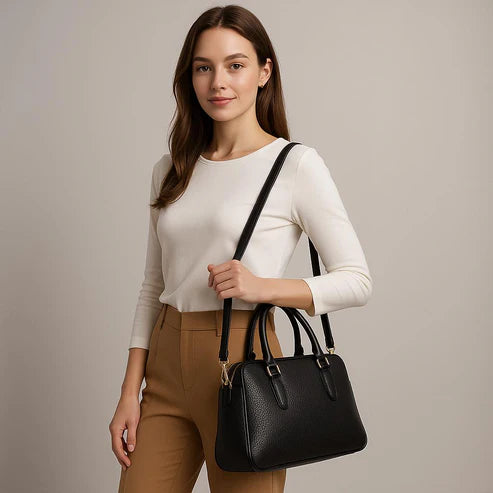 Premium black leather office bag for men and women, professional briefcase with sleek design, durable handle, and spacious compartments for laptop and documents.