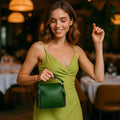 Elegant green leather handbag with gold-tone hardware — LeatherLuxe women’s shoulder bag made from premium genuine leather, ideal for everyday style and fashion.