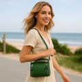 Elegant green leather handbag with gold-tone hardware — LeatherLuxe women’s shoulder bag made from premium genuine leather, ideal for everyday style and fashion.