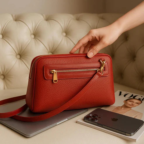 LeatherLuxe premium red leather clutch bag with gold hardware, designed for crossbody and shoulder wear, elegant women's accessory for evening and casual outings.