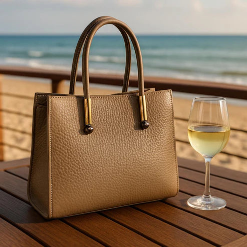 LeatherLuxe beige women's leather handbag with adjustable shoulder strap, elegant crossbody design, perfect for casual and formal use.