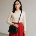 LeatherLuxe black leather women's shoulder bag and crossbody purse with sleek design and gold-tone hardware
