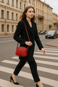 LeatherLuxe red leather women's shoulder bag with adjustable crossbody strap, elegant and stylish design for everyday fashion.