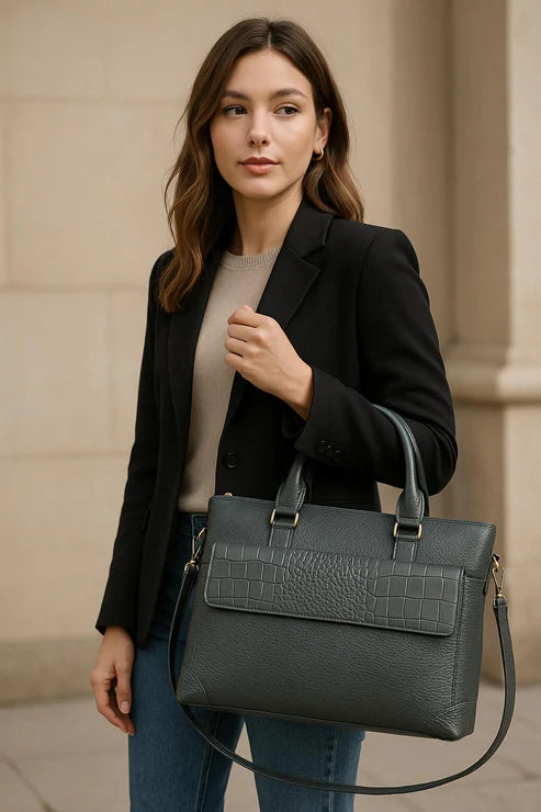 Premium gray leather laptop bag for men and women – sleek unisex professional briefcase with handle and shoulder strap for business and travel.