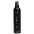 Black bottle of Schwarzkopf Silhouette hair mousse on a white background