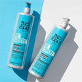 Two bottles of Bed Head Re:Cover shampoo and conditioner on a light blue and white background