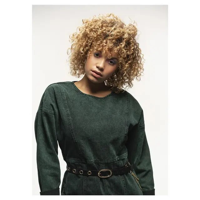 Person wearing a green jumpsuit with a belt on a white background