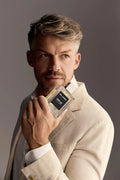 Virtue Eau De Parfum for men in sleek glass bottle with black label and cap, displayed with lifestyle shots and luxury background