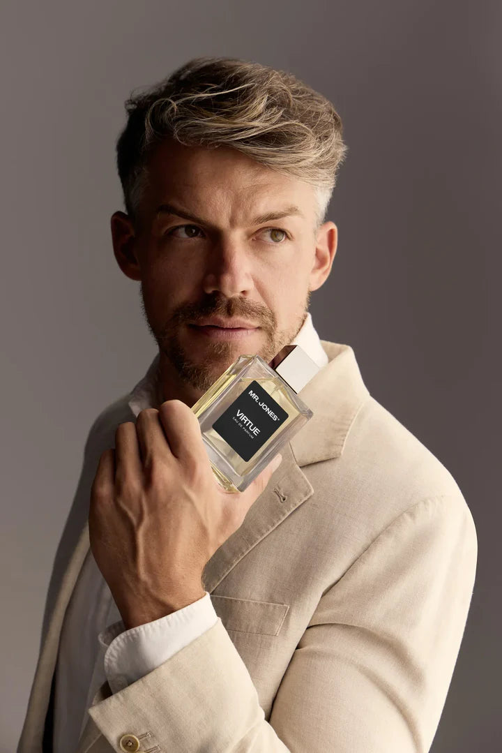 Virtue Eau De Parfum for men in sleek glass bottle with black label and cap, displayed with lifestyle shots and luxury background