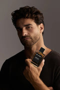 Virtue Eau De Parfum for men in sleek glass bottle with black label and cap, displayed with lifestyle shots and luxury background