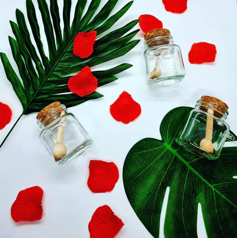 Lavvish Lavender and Rose Bath Salts in glass jar with wooden spoon and floral accents