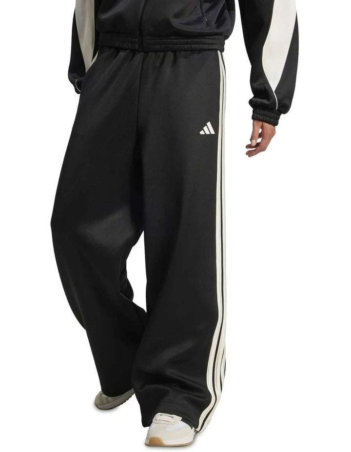 Adidas Stadium Stripes Tracksuit Bottoms in black with signature 3-Stripes, soft recycled polyester-cotton blend, satin piping, and matte rubber-print logo.