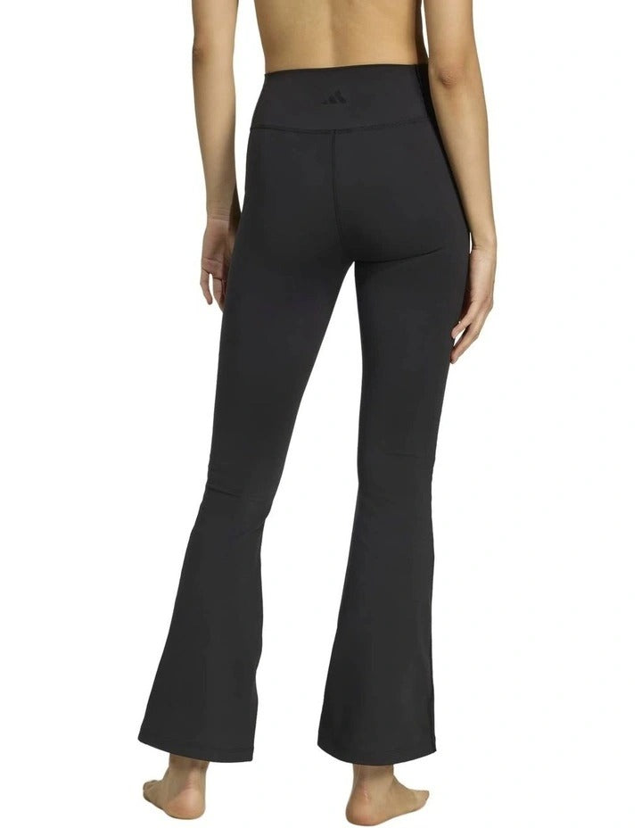 Adidas All Me Essentials Flare Leggings in black, made from 85% recycled polyester and 15% elastane, featuring flared legs and ClimaCool sweat-wicking fabric for gym and studio workouts