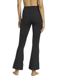 Adidas All Me Essentials Flare Leggings in black, made from 85% recycled polyester and 15% elastane, featuring flared legs and ClimaCool sweat-wicking fabric for gym and studio workouts
