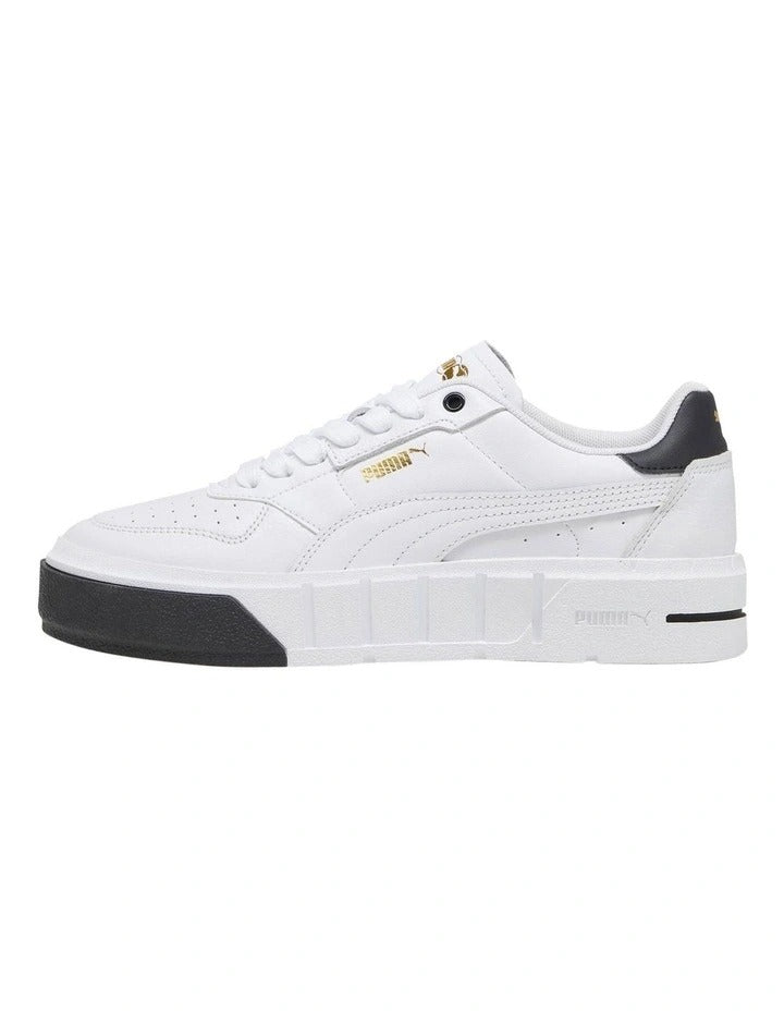 White sneaker with black accents on a white background